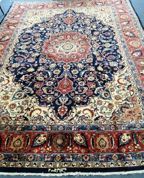 A Tabriz blue ground carpet 340 x 245cm